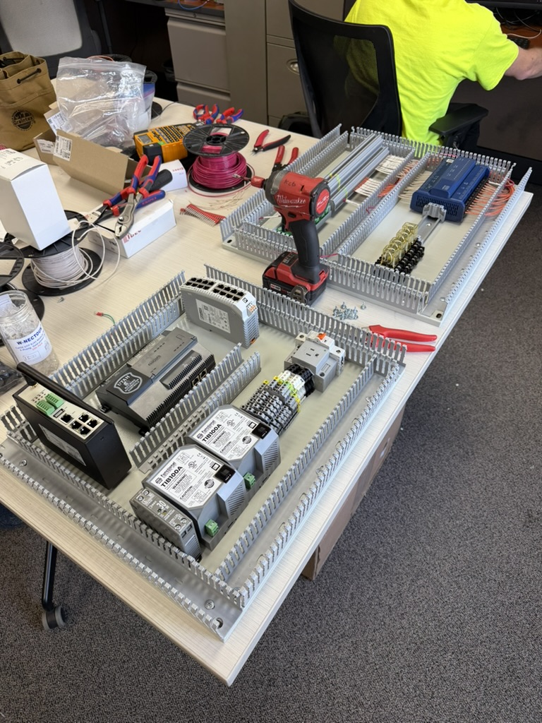 Building control panels being assembled on a workbench